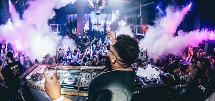 man playing DJ turntable